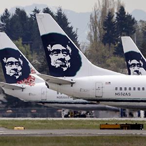 Alaska Airline jets are parked at Seattle-Tacoma International Airport on April 23, 2013 (© Elaine Thompson/AP Photo)
