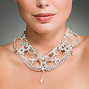 Woman wearing a diamond necklace copyright Image Source, Corbis