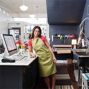 Young Woman Florist Small Business Flower Shop Owner, Checkout Counter copyright YinYang, the Agency Collection, Getty Images