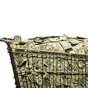 Shopping cart full of cash copyright RubberBall , SuperStock