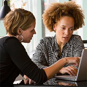 Businesswomen looking at laptop copyright Ariel Skelley, Blend Images, Getty Images