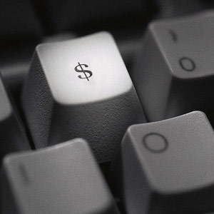 Dollar sign on keyboard © Corbis