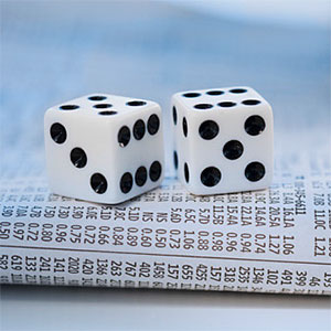 Dice on newspaper stock pages © Tom Grill, Photographer