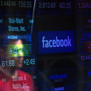 Facebook logo on a screen at the Nasdaq market site (© Shannon Stapleton/Newscom/Reuters)