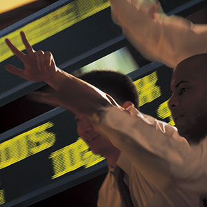 Stock market Traders (© Comstock/Corbis)