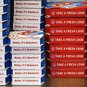 Domino's Pizza boxes (© Luke MacGregor/Newscom/Reuters)