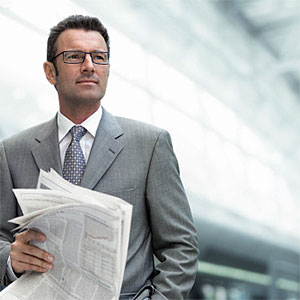 Businessman with newspaper © H-Gall, Vetta, Getty Images