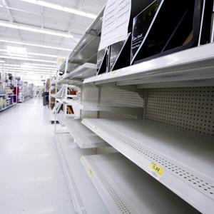File photo of empty shelves in a New Jersey Wal-Mart (© Najlah Feanny/Corbis)