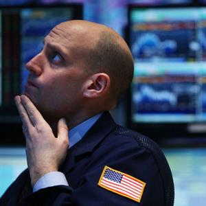 A trader works on the floor of the New York Stock Exchange minutes after a Federal Reserve announcement on January 29, 2014 in New York City
© Spencer Platt/Getty Images