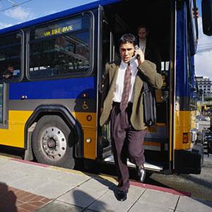 Businessman and bus (© Photodisc Green/Getty Images)