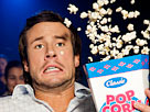 Image: Man reacting to a film at the cinema, popcorn flying (© i love images/Cultura RF/Getty Images)