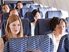 Image: Passengers on an airplane (© Image Source/Getty Images)