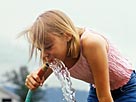 Image: Girl Drinking from a Hose © Vicky Kasala/Photodisc/Getty Images