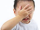 Image: Boy hiding eyes (© Ned Frisk Photography/Corbis)
