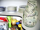 Image: U. S. banknotes on shelf in kitchen pantry (© Supapixx /Alamy)