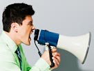 Image: Businessman with Megaphone (© Larry Dale Gordon/zefa/Corbis)