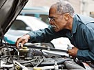Image: Man working on car © Jose Luis Pelaez Inc/Blend Images/Getty Images