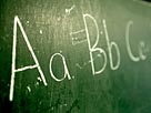 Image: A green chalkboard with the alphabet written on it © Ocean/Corbis /Corbis