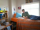Image: Student in dorm room (© Digital Vision Ltd./SuperStock)