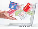 Hands catching shopping coupons (© Vstock LLC/Tetra images RF/Getty Images)