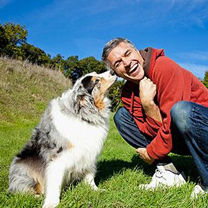 Logo: Man with dog VStock LLC, Tanya Constantine, Tetra images, Getty Images