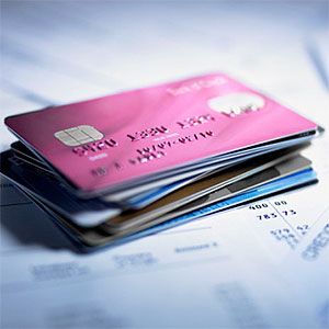 Logo: Close up of stack of credit cards (Adam Gault, OJO Images, Getty Images)