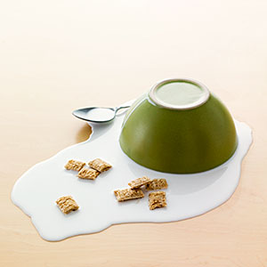 Logo: Bowl of Spilled Milk and Cereal (David Arky/Corbis)