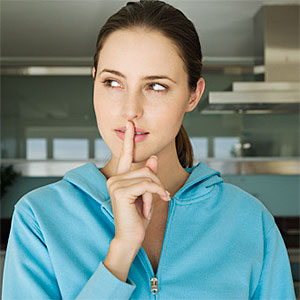 Logo: Portrait of a young woman, finger on lips (Pascal Broze, ONOKY, Getty Images) 