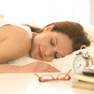 Logo: Woman asleep (Tom Grill/Corbis)