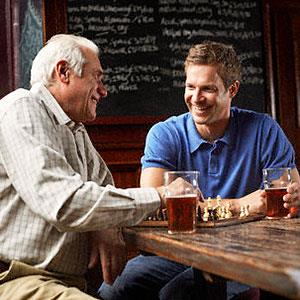 Image: Men drinking beer -Radius Images, Corbis
