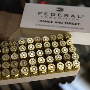 Credit: Scott Olson/Getty Images
Caption: A box of .45 cal. ammunition is offered for sale