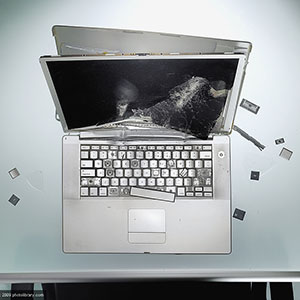 Image: Damaged laptop ( Jason Stang/PHOTOLIBRRAY/Photo Library)