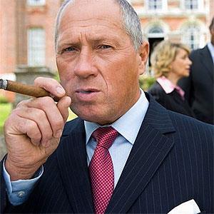 Businessman with cigar --Juice Images , SuperStock 