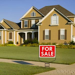 Exterior of home with for sale sign