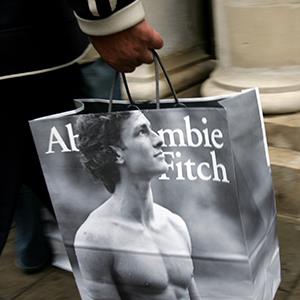 A shopper leaves the Abercrombie & Fitch UK Flagship Store on Savile Row in London, England (© Gareth Cattermole/Getty Images)