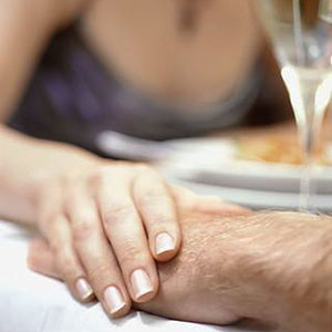 Image: Couple holding hands (© Corbis/Corbis)
