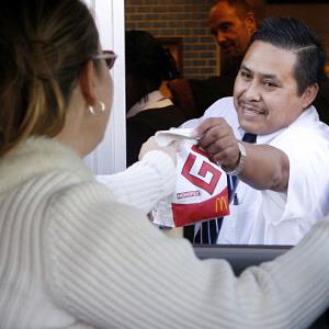 Marino Ahuatl works the drive through station at a McDonalds in Wheaton, Ill. (© Antonio Perez/Chicago Tribune/MCT via Getty Images)