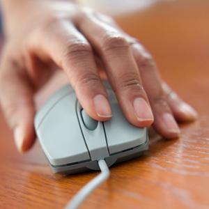 Woman using computer mouse © Jose Luis Pelaez, Inc/Blend Images/Getty Images