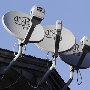Three Dish Network satellite dishes at an apartment complex in Palo Alto, Calif. (© Paul Sakuma/AP Photo)