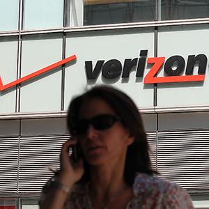 Wioman on phone outside a Verizon Wireless store
