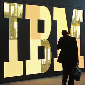 A man walks past the IBM logo at the CeBIT technology trade fair on February 28, 2011 in Hanover, Germany (copyright Sean Gallup/Getty Images)