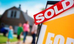 Sold sign; © Simon Jarratt/Corbis