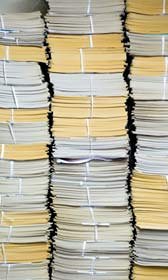 Stacks of papers (© Win Initiative/Getty Images)