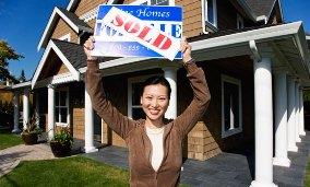 Woman buying house (© Corbis). Image ID: 42-17428485