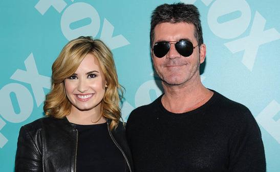 Demi Lovato and Simon Cowell/WENN