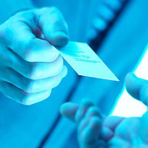 Caption: Businessmen exchanging business cards
Credit: © Andrew Bret Wallis/ Getty Images