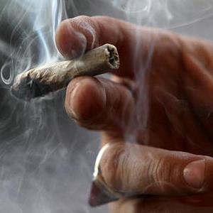 A medicinal marijuana user smokes at the Berkeley Patients Group in Berkeley, Calif., on March 25, 2010 (© Justin Sullivan/Getty Images)