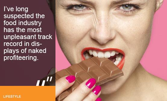 Woman biting on chocolate bar (Image (c) Oppenheim Bernhard/Lifesize/Getty Images)
