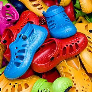 Credit: © Niels Poulsen DK/Alamy
Caption: Heap of plastic Crocs shoes
