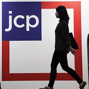 Caption: Customers shop at a J.C. Penney store, in New York
Credit: (© Mark Lennihan/AP)